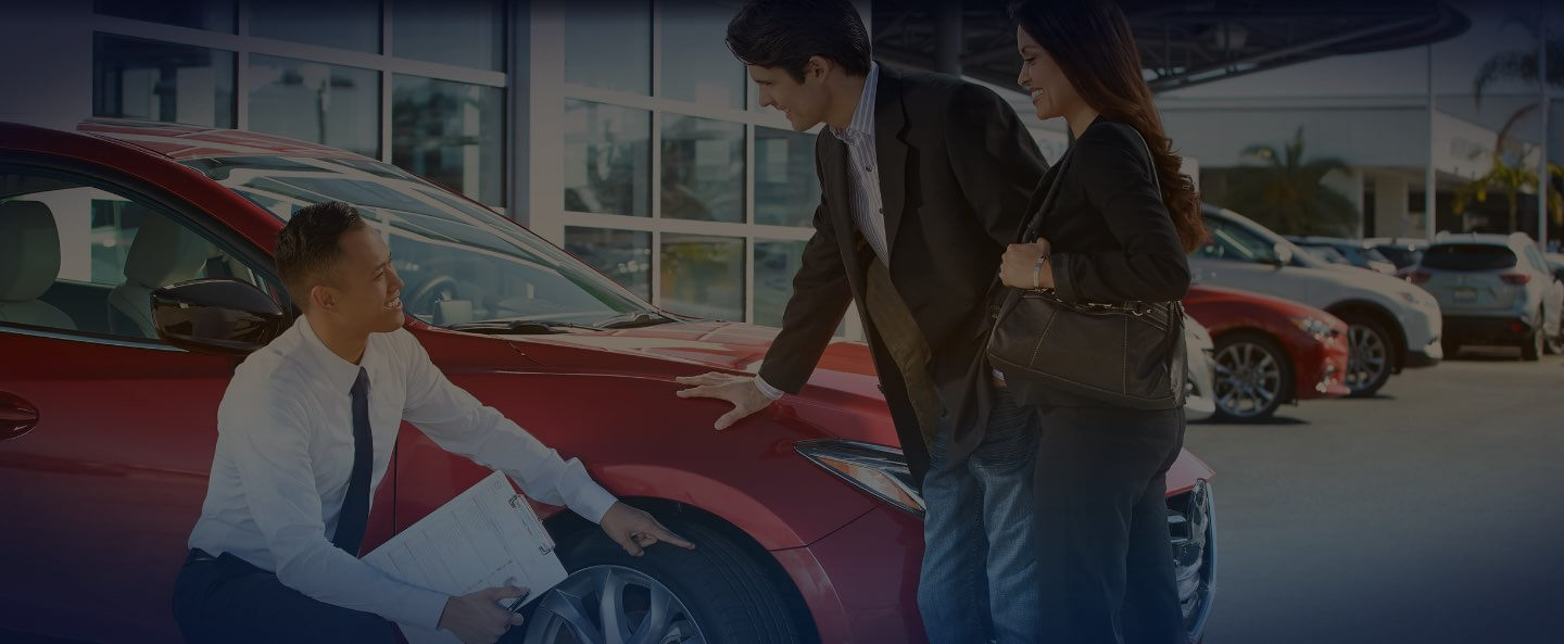 Technician talking to Mazda customer